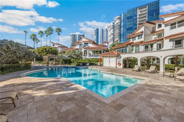 a view of a swimming pool with a patio