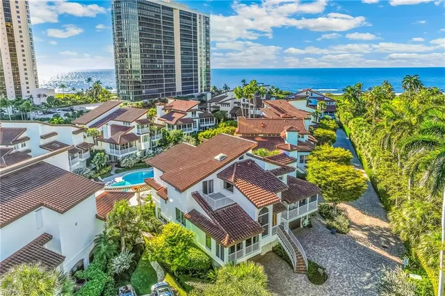 an aerial view of residential house with outdoor space and swimming pool
