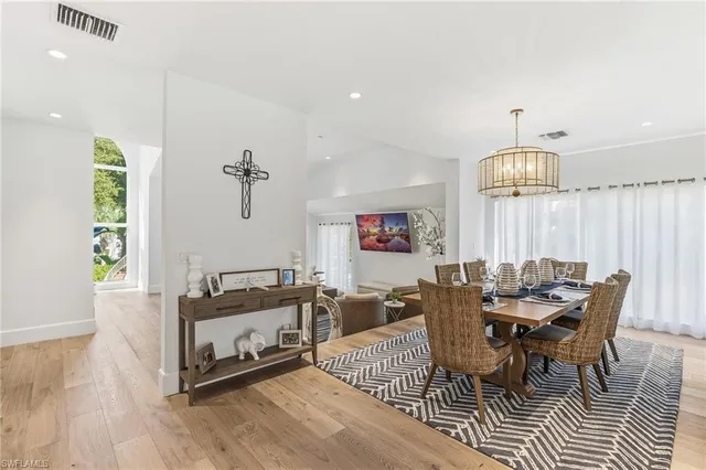 a dining room with furniture and window