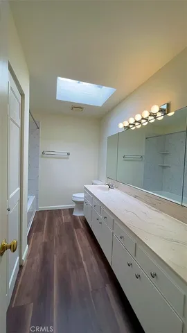 a bathroom with a sink and mirror