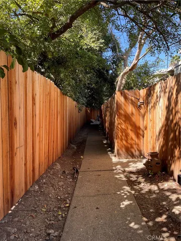 a view of backyard with large trees