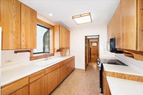 a spacious bathroom with a double vanity sink and a large mirror