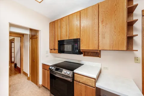 a kitchen with a stove and a microwave