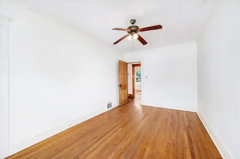 a view of room with wooden floor