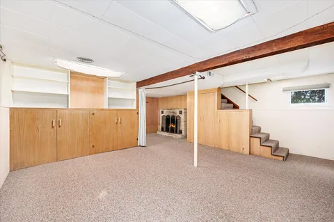 a view of a livingroom with wooden floor and closet