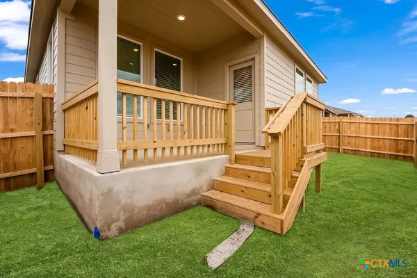 a view of a house with a small yard