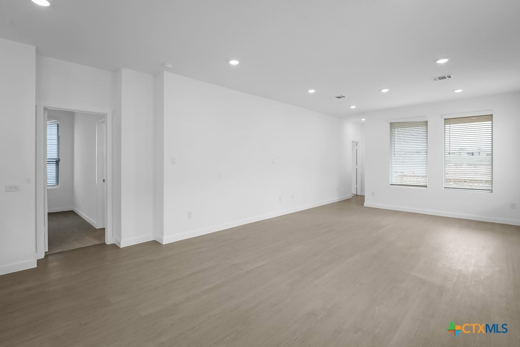 247 Flathead New Braunfels, TX 78130 - Photo 4 of 17 Unfurnished room featuring recessed lighting and wood finished floors