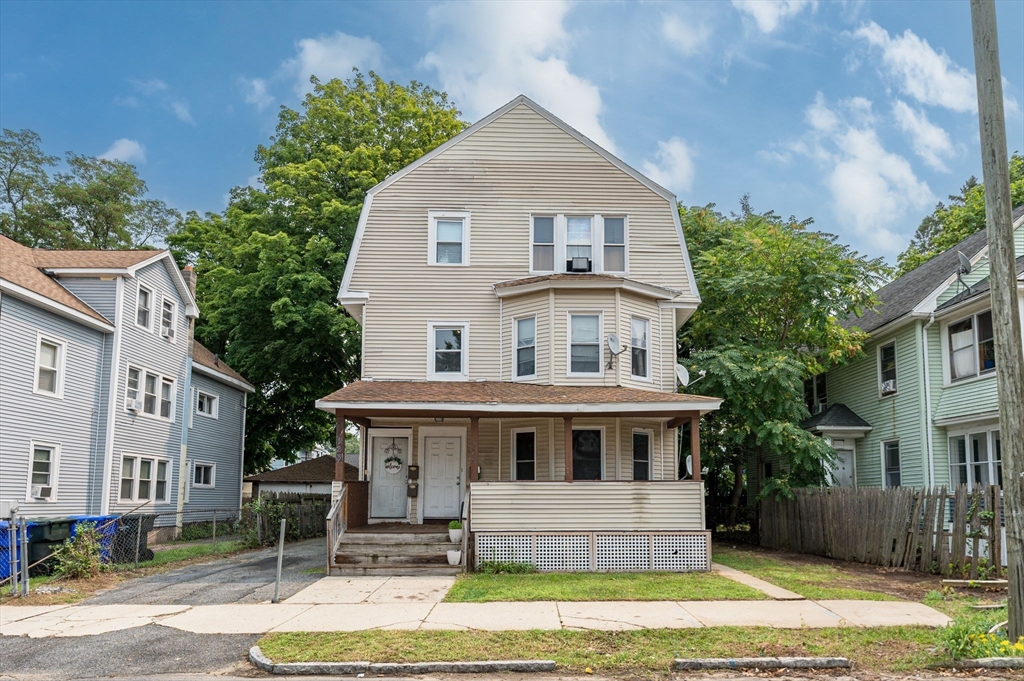 123-125 Ranney Street Springfield, MA 01108 - Photo 1 of 26 a front view of a house with a yard