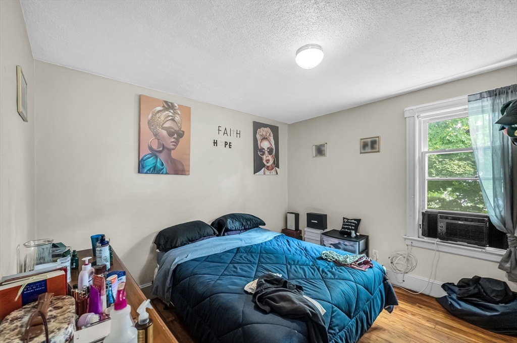 123-125 Ranney Street Springfield, MA 01108 - Photo 15 of 26 a living room with furniture and a window