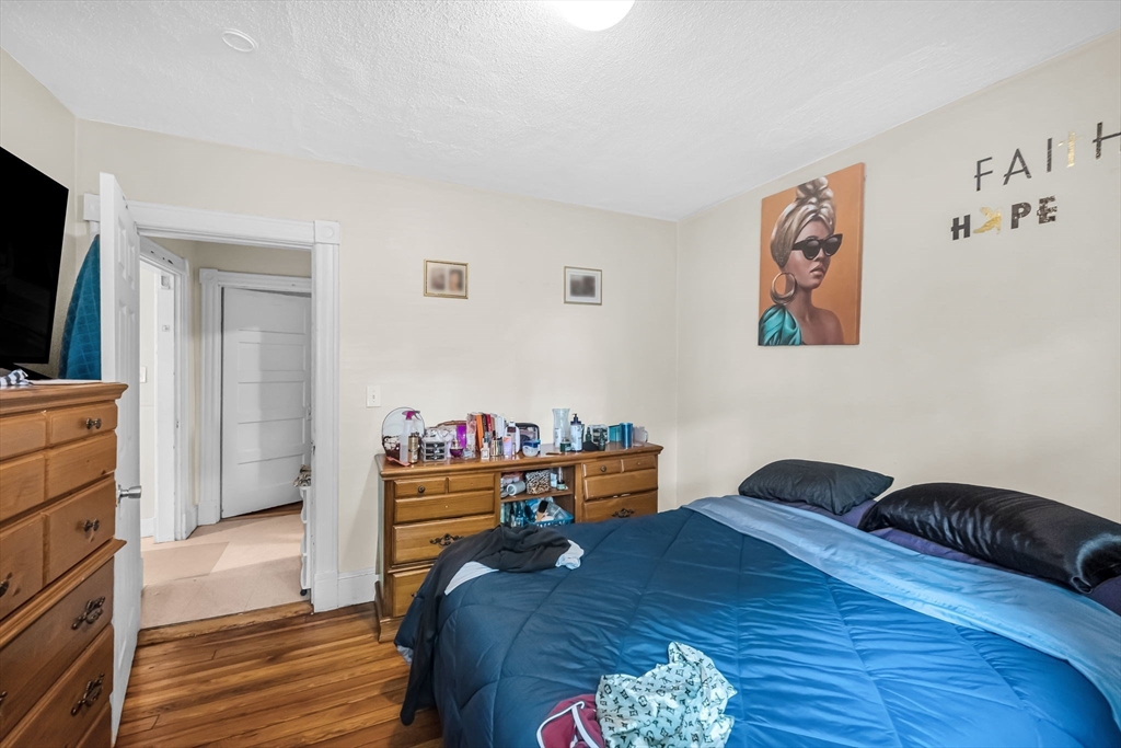 123-125 Ranney Street Springfield, MA 01108 - Photo 16 of 26 a bedroom with a bed and a dresser in it