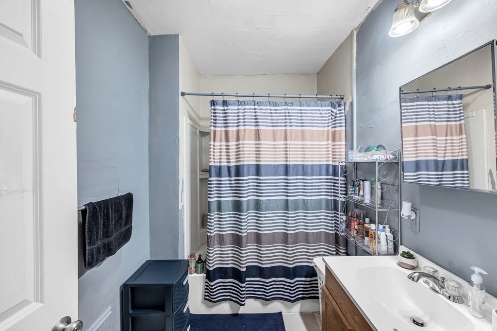 123-125 Ranney Street Springfield, MA 01108 - Photo 18 of 26 a bathroom with a sink a toilet and shower