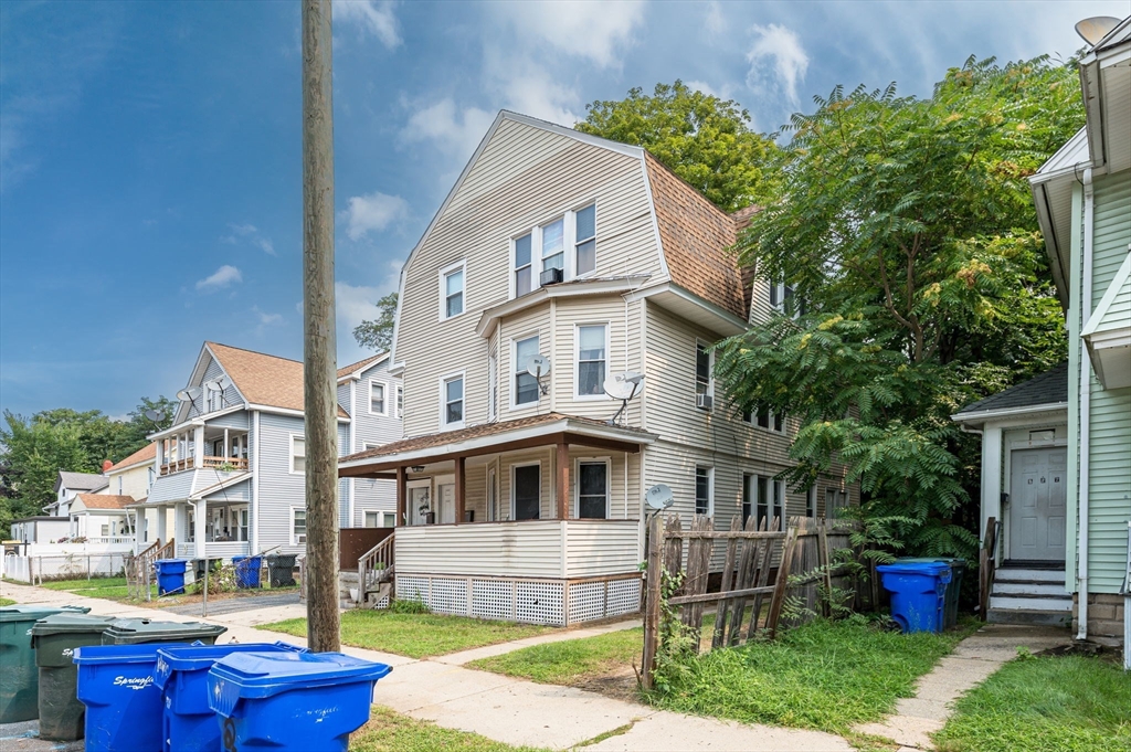 123-125 Ranney Street Springfield, MA 01108 - Photo 2 of 26 a front view of residential houses with yard and green space