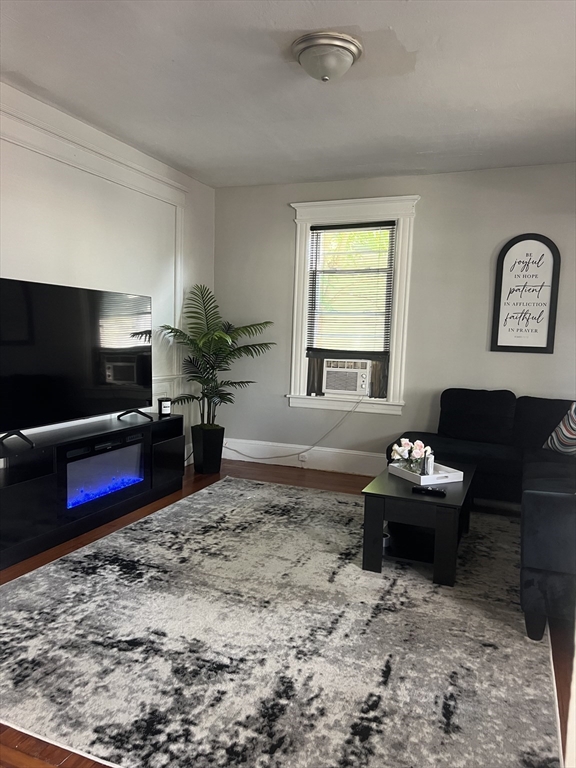 123-125 Ranney Street Springfield, MA 01108 - Photo 21 of 26 a living room with furniture and a flat screen tv