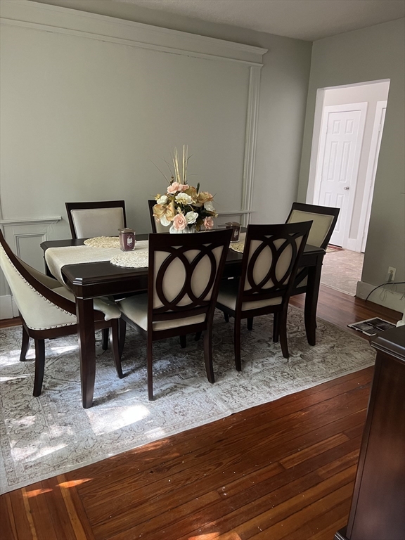 123-125 Ranney Street Springfield, MA 01108 - Photo 22 of 26 a view of a dining room with furniture and wooden floor