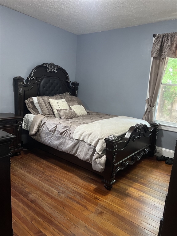 123-125 Ranney Street Springfield, MA 01108 - Photo 23 of 26 a bedroom with a bed and a window