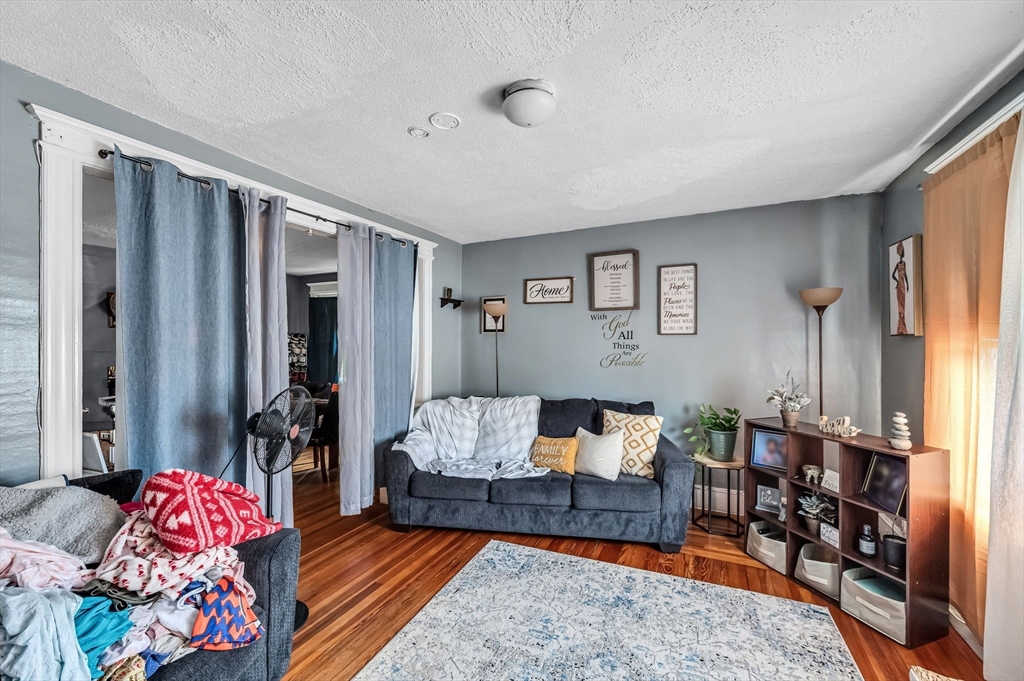 123-125 Ranney Street Springfield, MA 01108 - Photo 7 of 26 a living room with furniture and a couch
