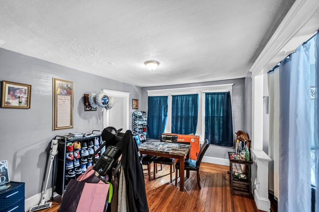 123-125 Ranney Street Springfield, MA 01108 - Photo 10 of 26 a view of a livingroom with furniture and a window