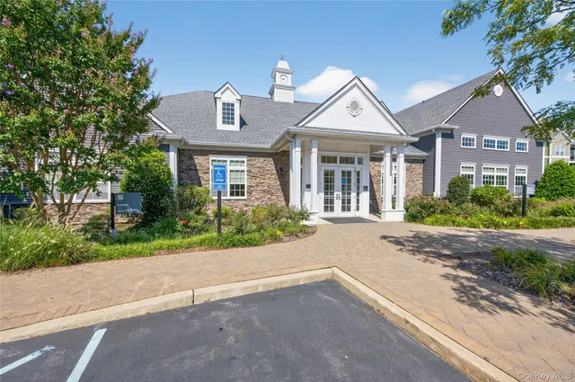 a sign that is sitting in front of flowers