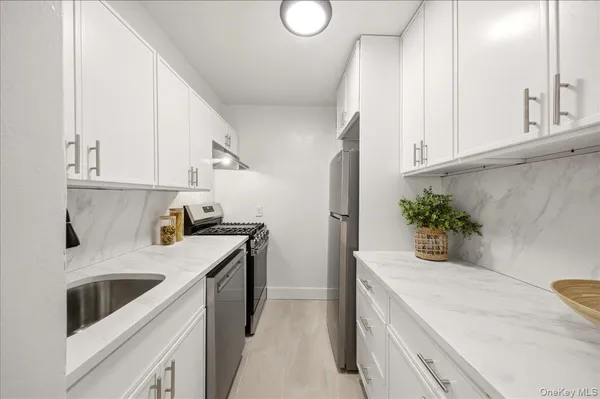 a kitchen with a sink stove and refrigerator