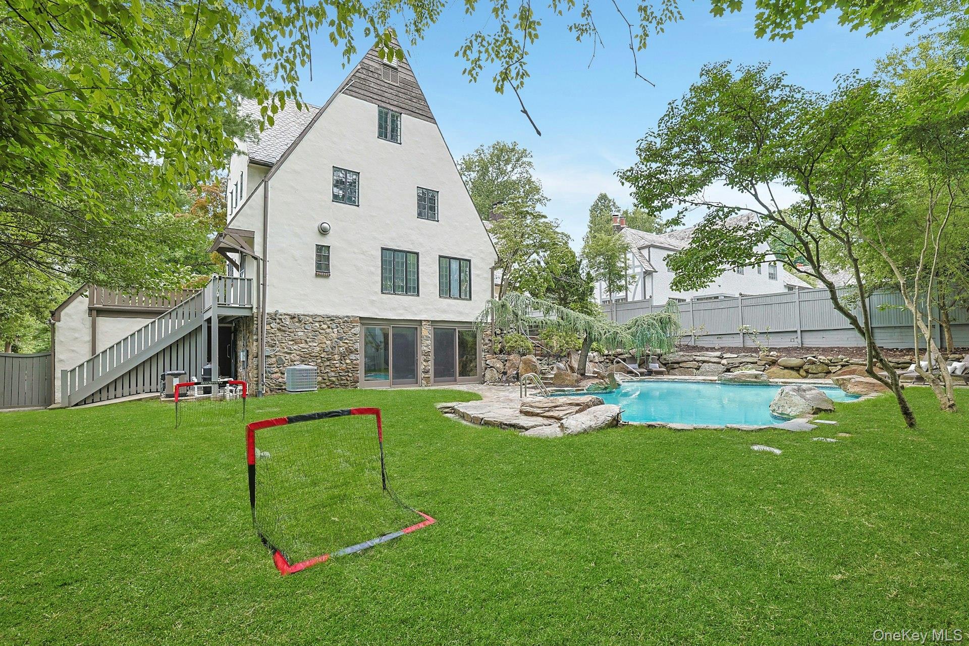 14 Withington Road Scarsdale, NY 10583 - Photo 37 of 41 a view of backyard with a garden and plants