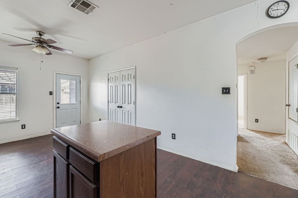 200 Firebush Way Buda, TX 78610 - Photo 14 of 29 an empty room with a window and wooden floor