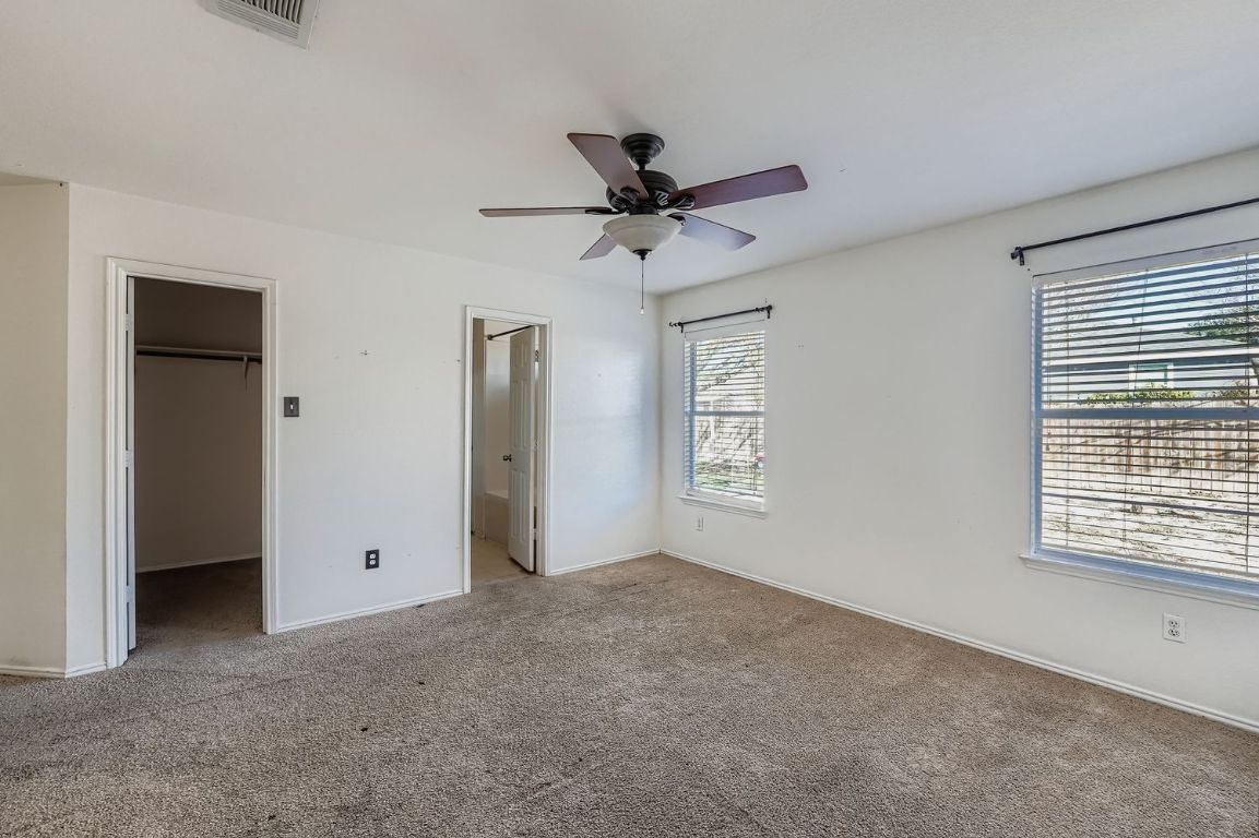 200 Firebush Way Buda, TX 78610 - Photo 18 of 29 a view of a livingroom with a window and a ceiling fan