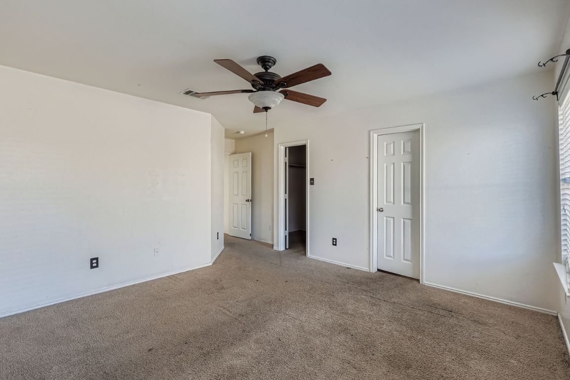 200 Firebush Way Buda, TX 78610 - Photo 20 of 29 a view of empty room with a ceiling fan