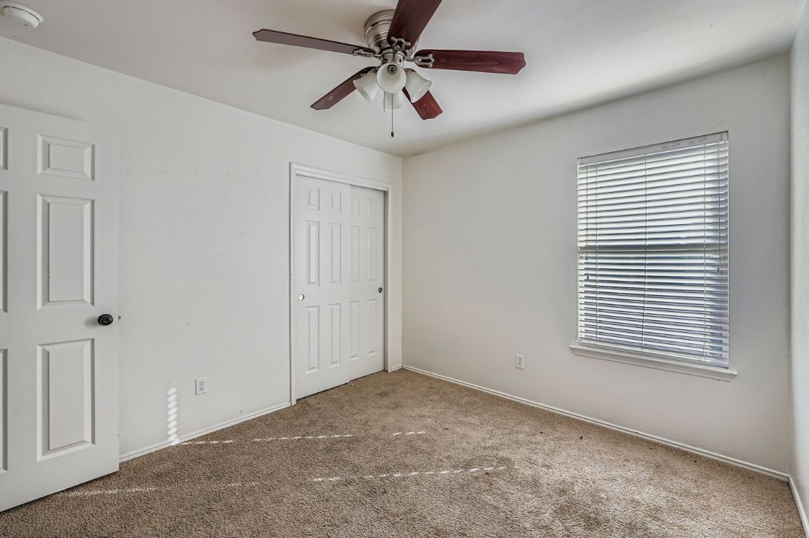 200 Firebush Way Buda, TX 78610 - Photo 23 of 29 a view of a livingroom with a ceiling fan and window