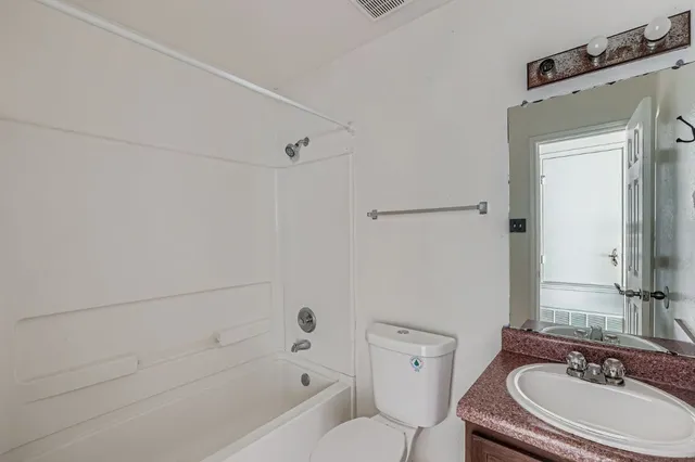 a bathroom with a sink a toilet and a bathtub