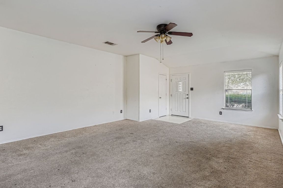 200 Firebush Way Buda, TX 78610 - Photo 6 of 29 a view of an empty room with a window