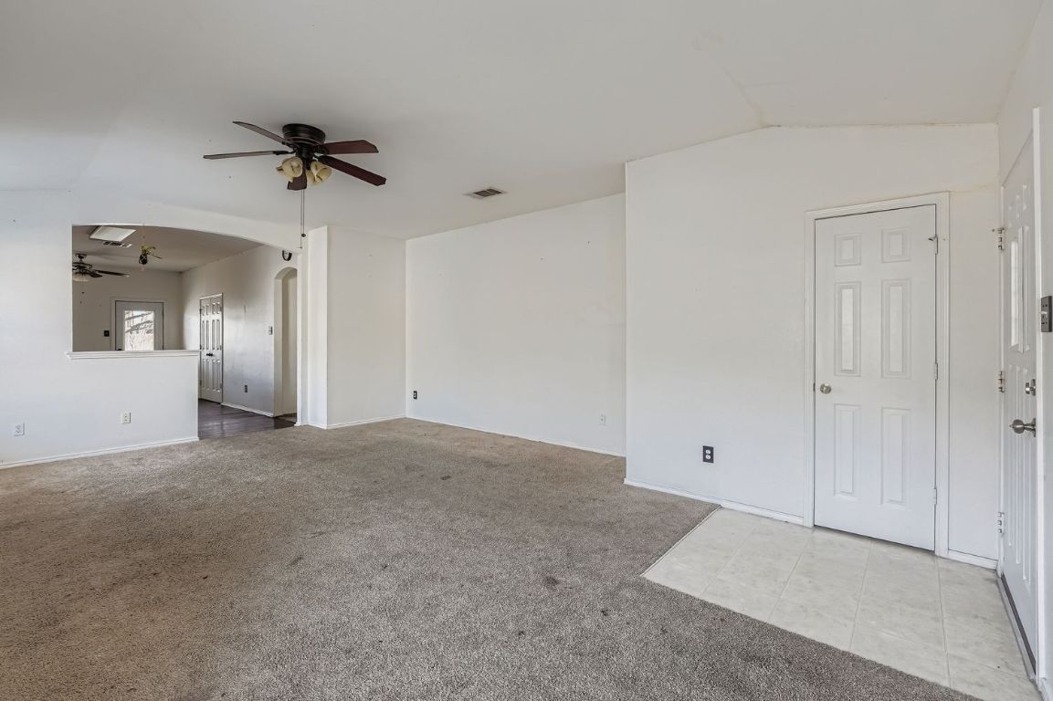 200 Firebush Way Buda, TX 78610 - Photo 8 of 29 a view of a big room with closet and chandelier fan