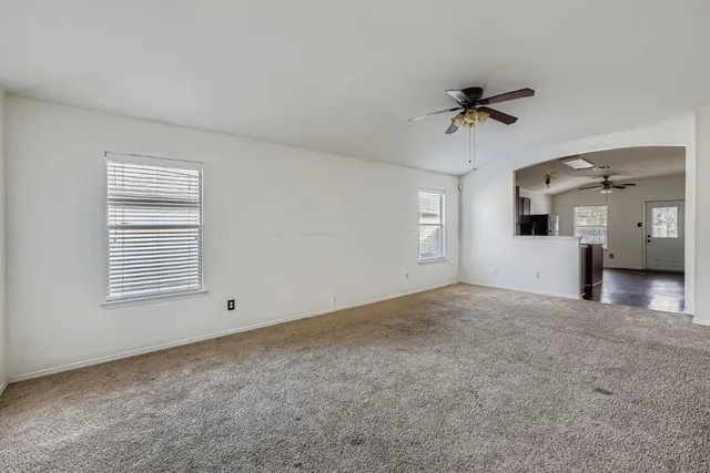 a view of an empty room with a window