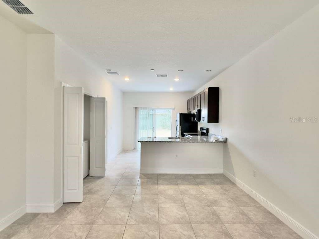 15885 Southwest 35th Court Road, Unit 1 Ocala, FL 34473 - Photo 11 of 27 a view of kitchen with refrigerator sink and microwave