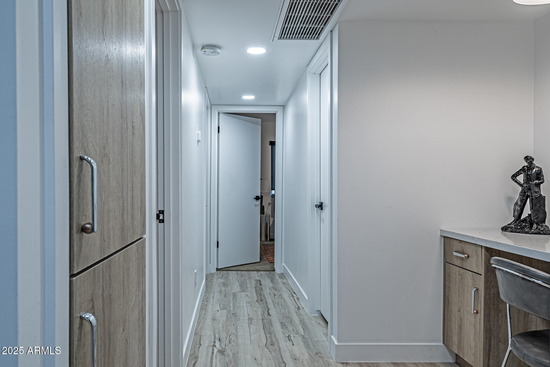 1539 West Puget Avenue Phoenix, AZ 85021 - Photo 18 of 29 a view of hallway with stainless steel appliances wooden floor