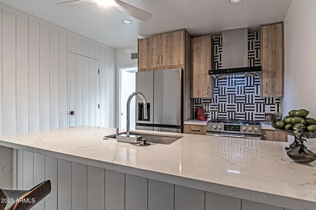 a kitchen with a stove and cabinets