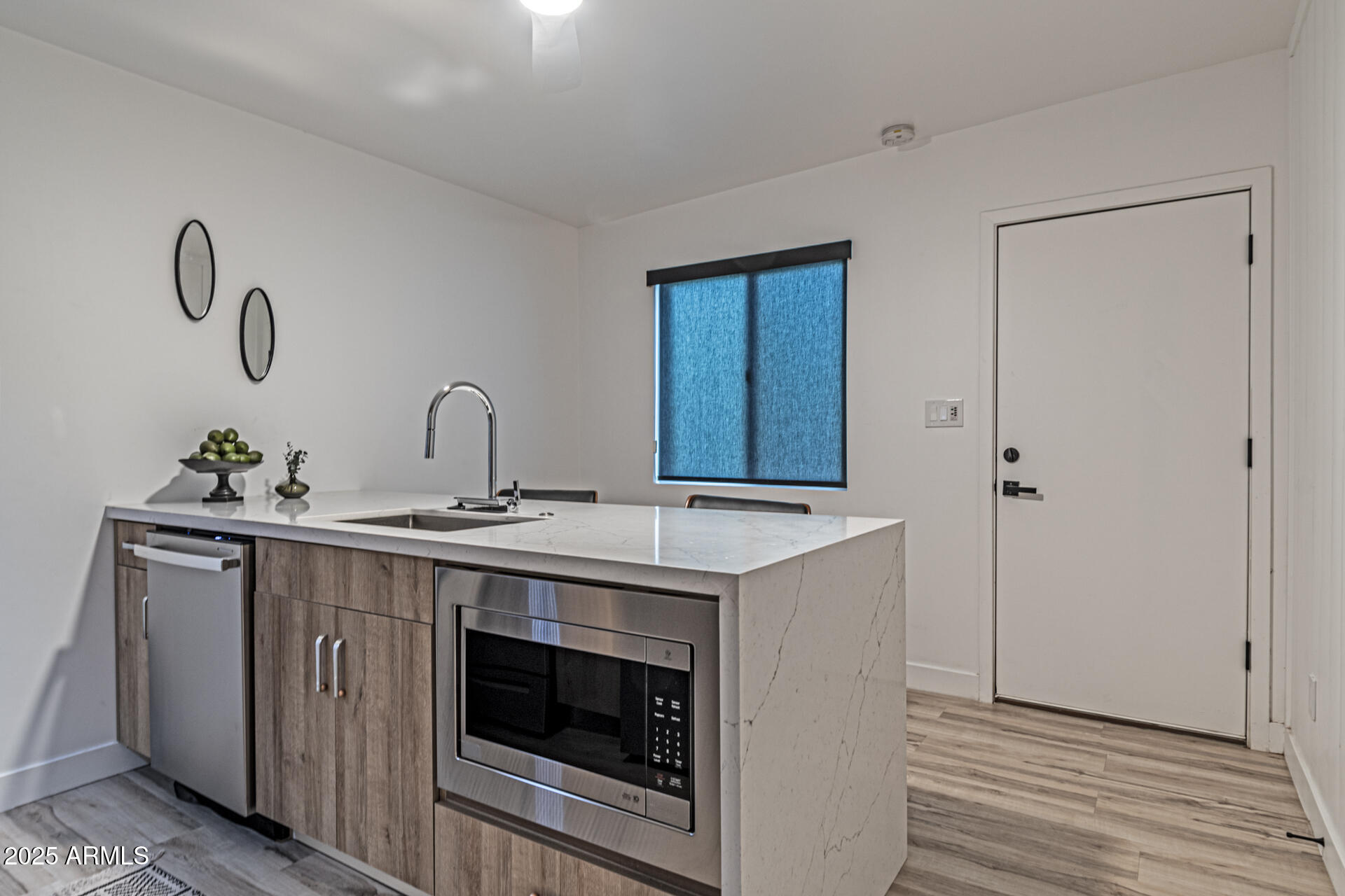 1539 West Puget Avenue Phoenix, AZ 85021 - Photo 23 of 29 a kitchen with a stove and cabinets