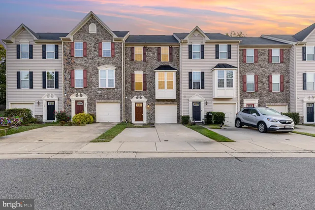 a view of multiple houses with a street