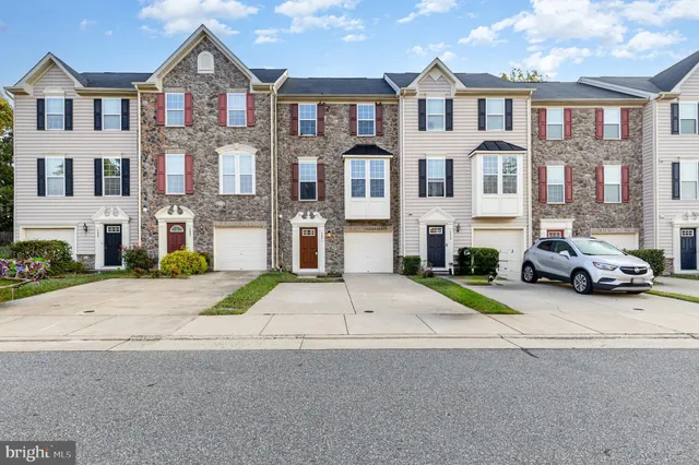 a view of multiple houses with a street