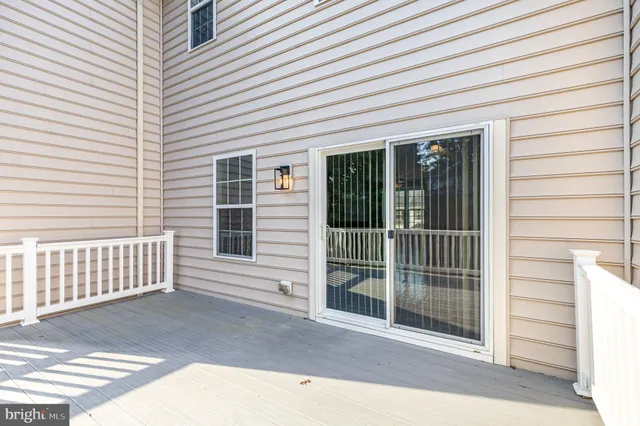 a view of a house with a door and wooden floor