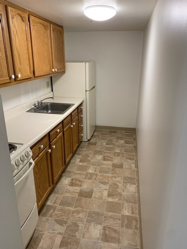314 Washington Road Pittsburgh, PA 15216 - Photo 9 of 9 a kitchen with granite countertop a sink stove and cabinets