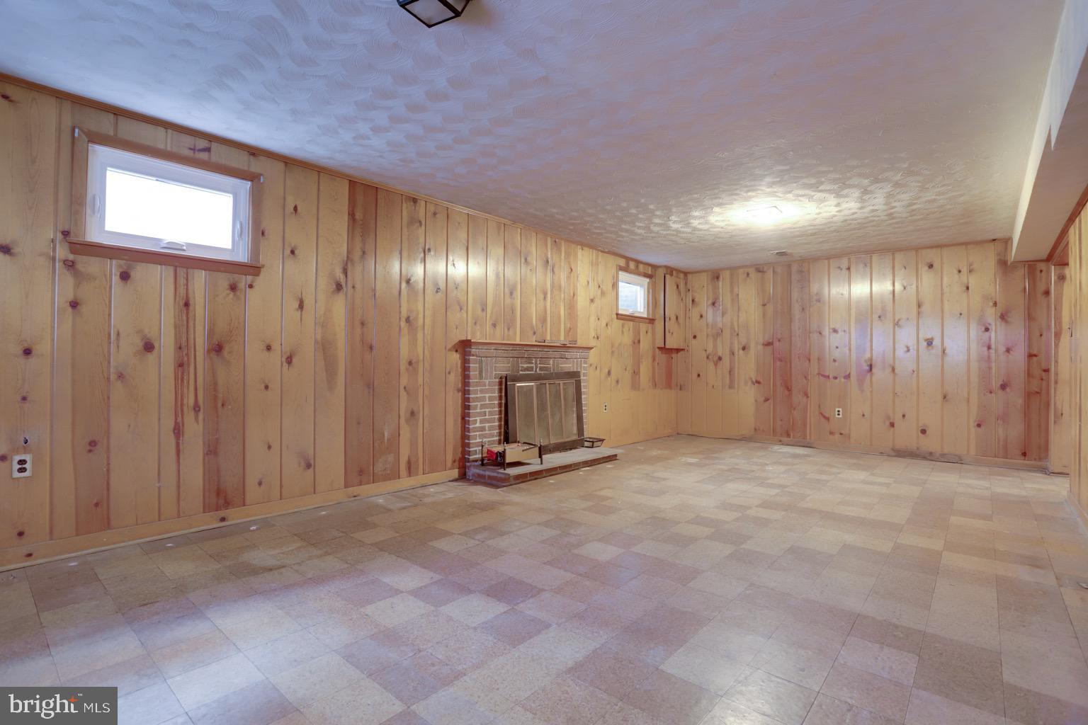 8802 2nd Avenue Silver Spring, MD 20910 - Photo 30 of 67 ...with original knotty pine paneling & fireplace.