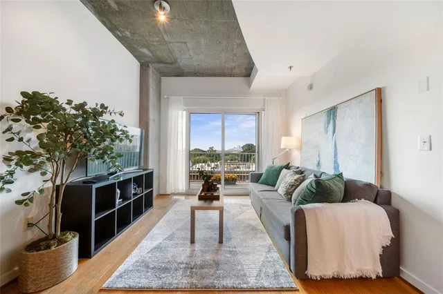 a living room with furniture and a large window