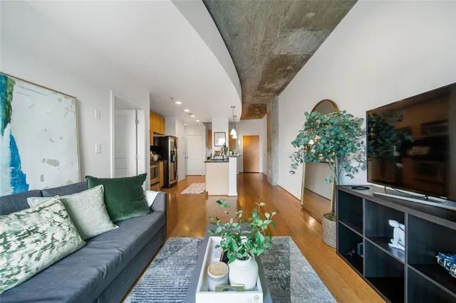 a living room with furniture and a flat screen tv