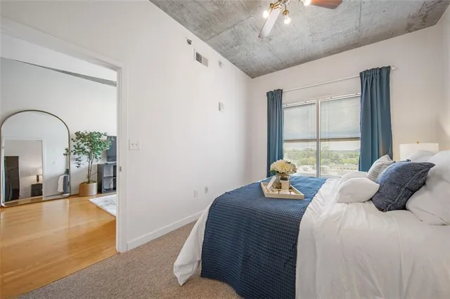 a bedroom with bed and window