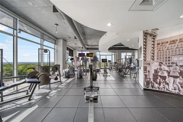a room with lots of furniture and a flat screen tv
