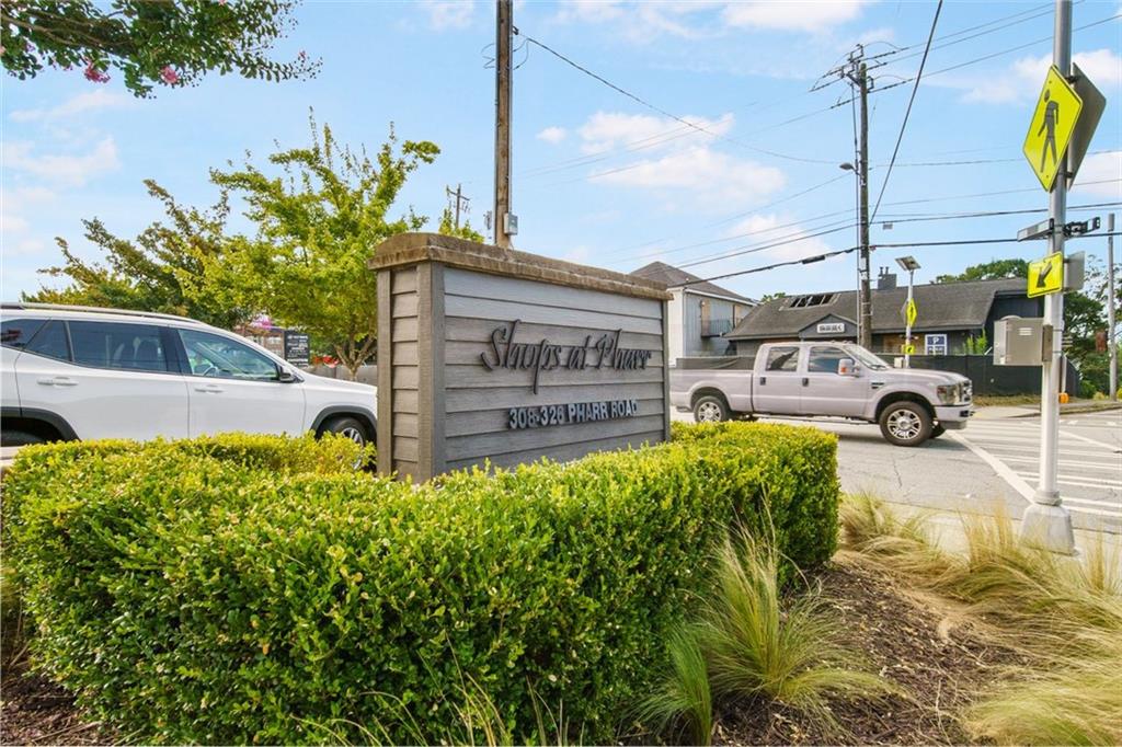 250 Pharr Road Northeast, Unit 412 Atlanta, GA 30305 - Photo 43 of 49 a view of a garden with a building in the background