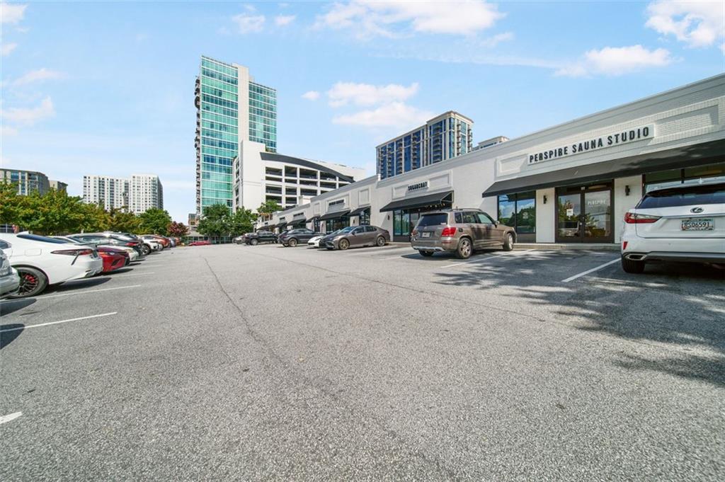 250 Pharr Road Northeast, Unit 412 Atlanta, GA 30305 - Photo 45 of 49 a car parked in front of a building