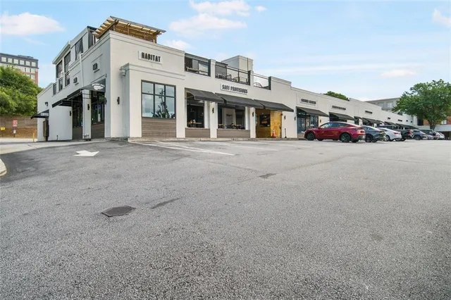 a view of a street with benches in the background