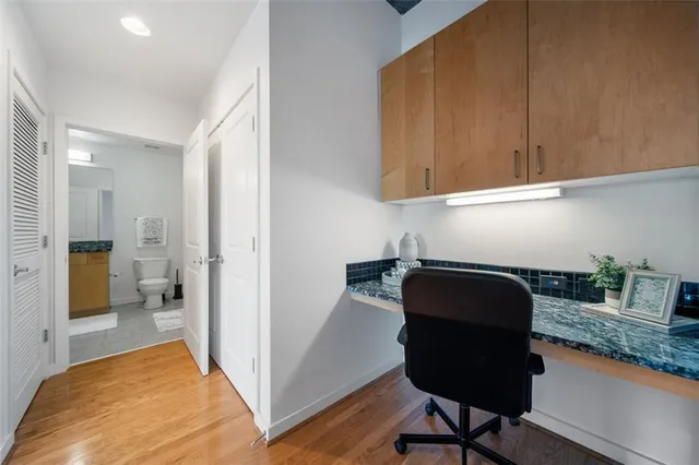 a kitchen with granite countertop wooden cabinets and a granite counter top