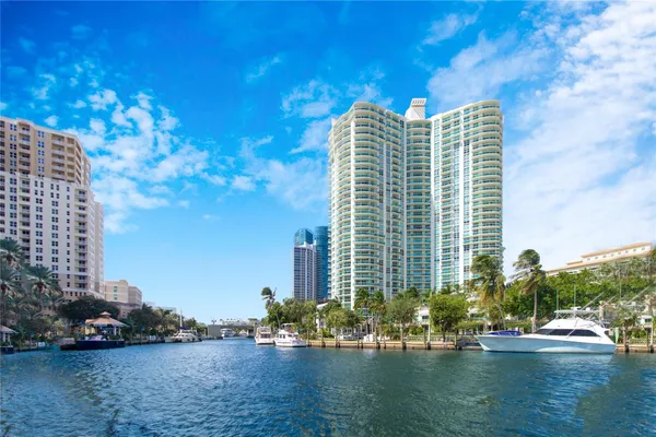 a view of a lake with tall buildings
